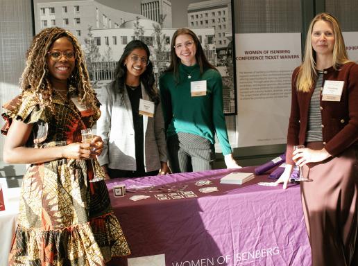 Women of Isenberg representatives at table at WFUM event