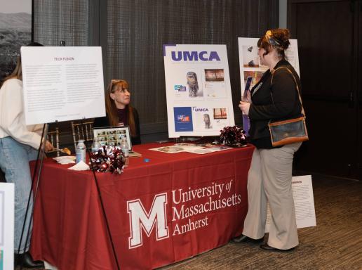 Tech Fusion Booth with women in discussion at Conversation with Women of UMass